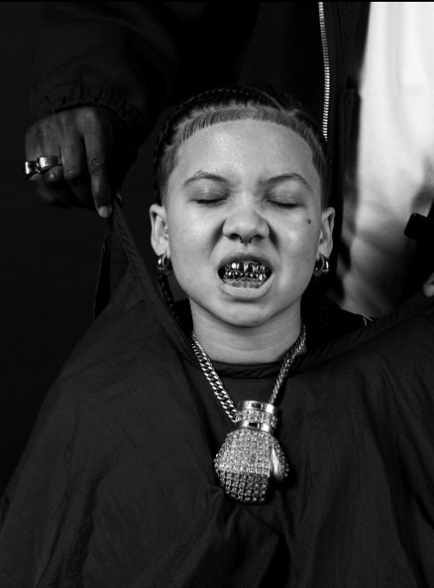 Portrait with grillz and layered necklaces